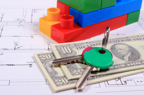 Банкноти, ключі і будівельні блоки на кресленні будинку
 - Фото, зображення