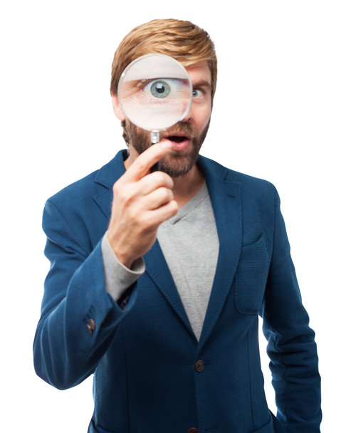 surprised businessman with magnifying glass - Фото, изображение
