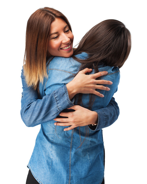 happy sisters hugging - Foto, afbeelding