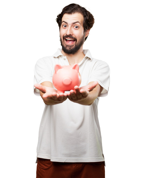 happy young man with piggy bank - Fotoğraf, Görsel