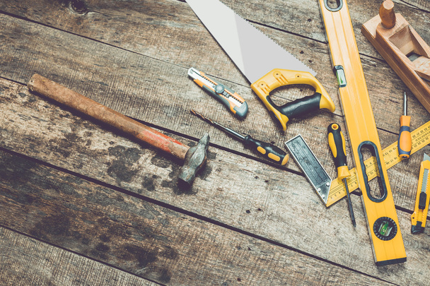 Assorted work tools on wood - Photo, image