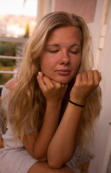 blonde with closed eyes at sunset - Photo, Image