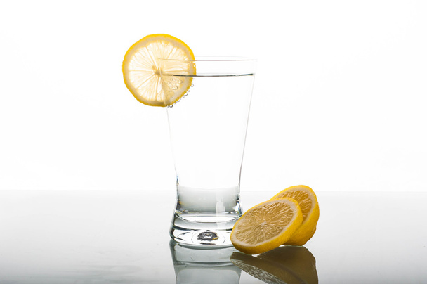 Glass of water with lemon slice - Fotó, kép