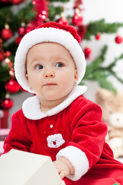 Baby girl and christmas tree - closeup - Fotografie, Obrázek