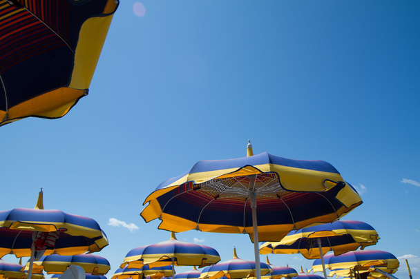 close up multicolored umbrellas beach sky - Fotó, kép