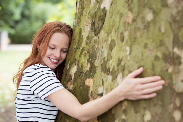 Nature-Lover Woman Hugging a Big Tree Trunk - Valokuva, kuva