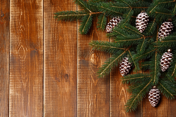 Christmas fir tree with decorations on wooden background. - Fotografie, Obrázek