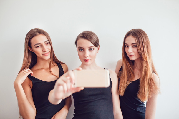 Beautiful Young Girls Taking a Selfie Photo with Phone - Foto, imagen
