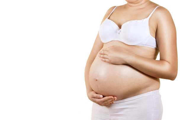 zwangere vrouw zorgen over haar buik - Foto, afbeelding