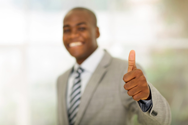 business executive giving thumb up - Foto, afbeelding
