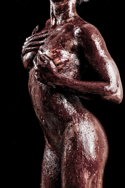 Sensual african model body covered with chocolate - Foto, imagen