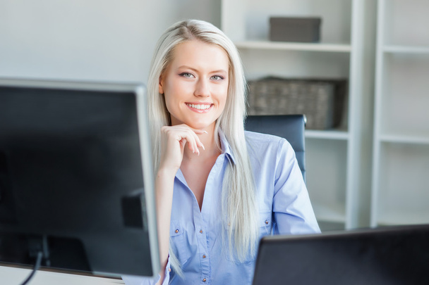 Young, attractive and confident business woman working in office - Foto, Imagem