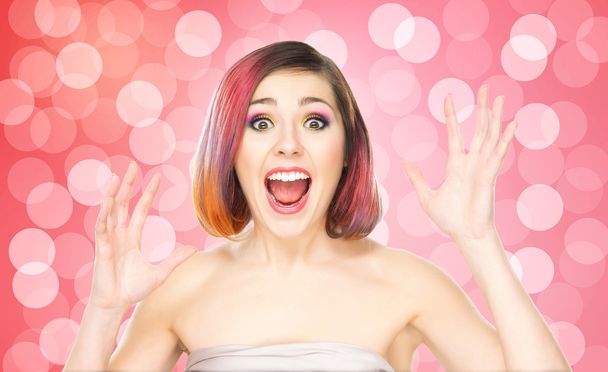 Beautiful smiling girl with colorful make-up on bubble background - Photo, image