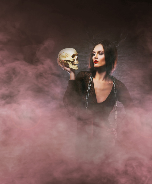 Halloween concept: young and sexy witch makes the witchcraft - Fotoğraf, Görsel