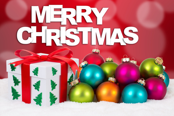 Весела різдвяна подарункова прикраса з червоним тлом
 - Фото, зображення