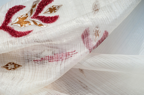 Texture, background. tulle, bobbin-net, bobbin, illusion. a soft, fine silk, cotton, or nylon material like net, used for making veils and dresses. White color with pattern urassnym - Photo, Image