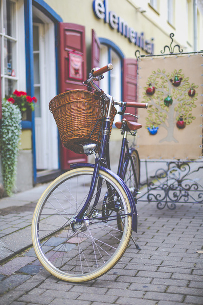 Old-fashioned bike on a street - Fotó, kép