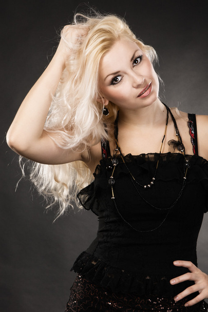 Blond model on black background - Foto, Imagen