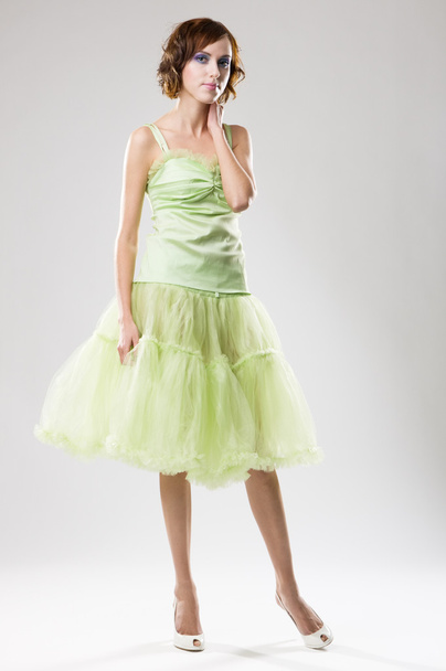 Young woman in green dress - Foto, afbeelding
