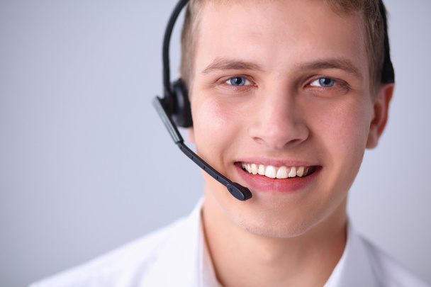 Shot of a smiling call center operator - Foto, Bild
