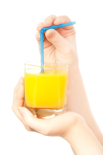 Woman's hands with a glass of orange juice - Zdjęcie, obraz