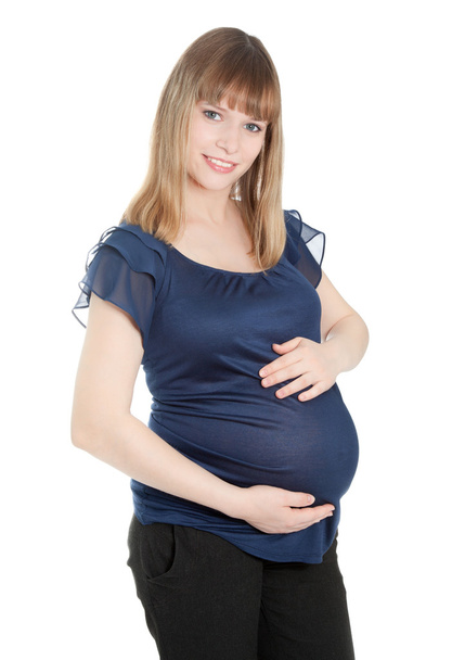 Beautiful pregnant woman looking to the camera - Фото, изображение