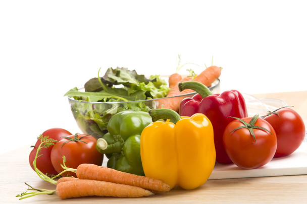 Mix of vegetables on salad on the wood background. - Photo, Image