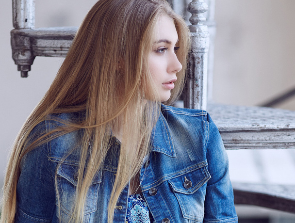 Portrait of blond female in denim jeans jacket. - Foto, Bild