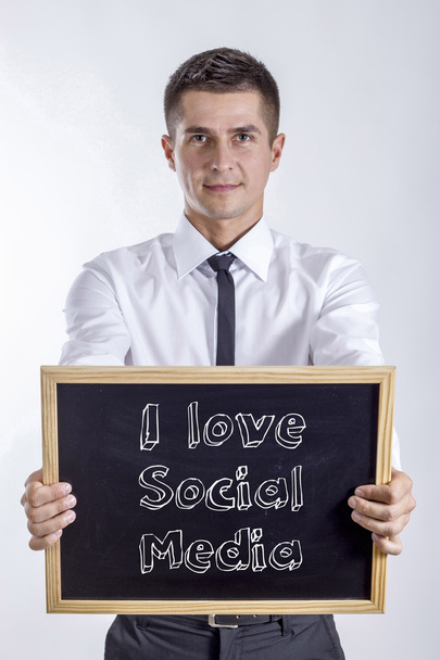 Λατρεύω κοινωνικών μέσων μαζικής ενημέρωσης - νέος επιχειρηματίας που κατέχουν Μαυροπίνακας - Φωτογραφία, εικόνα