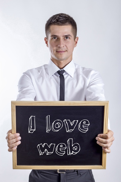 Λατρεύω web - νέος επιχειρηματίας που κατέχουν Μαυροπίνακας με κείμενο - Φωτογραφία, εικόνα