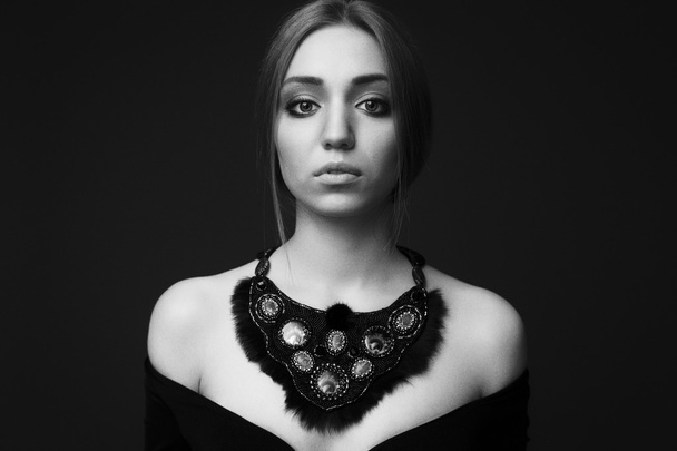 Portrait of young beautiful woman with handmade jewelry - Photo, Image