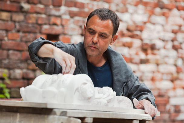 craftsman restorer working with gypsum model - Photo, Image