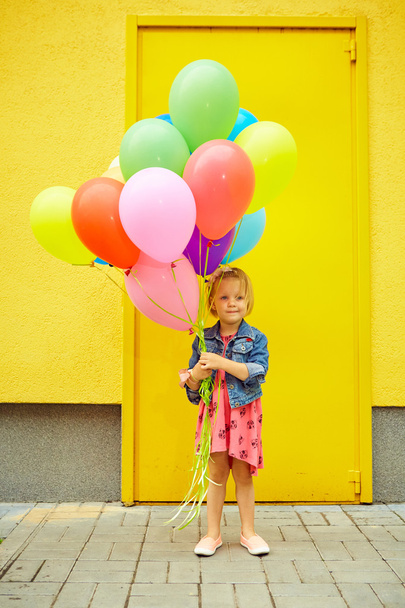 happy little girl outdoors with balloons - Fotó, kép