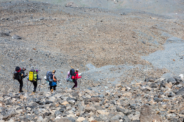 Rocky mountain footpath and group of hikers - Foto, Imagen