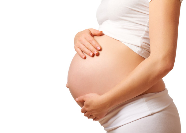 ventre de la femme enceinte sur fond blanc
 - Photo, image