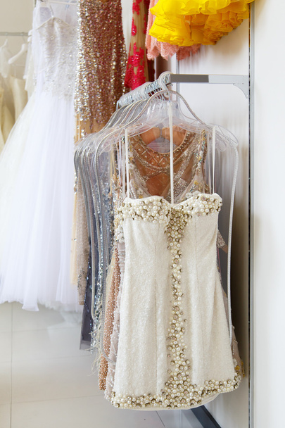 Evening dresses on hangers in store - Photo, Image