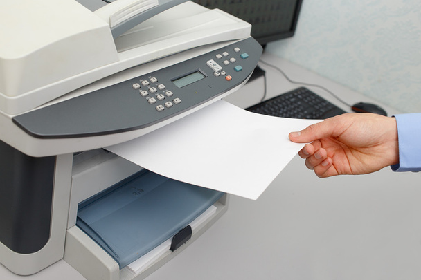 Businessman working with printer - Photo, Image