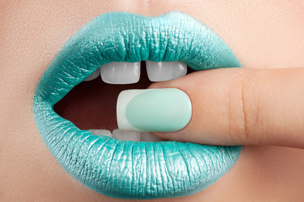 Lips close-up and manicure. - Photo, Image