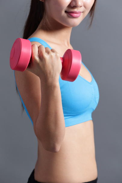 Sporty  woman  lifting weight - Fotó, kép