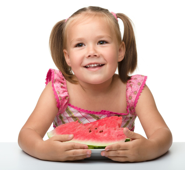 Cute little girl is going to eat watermelon - Фото, изображение