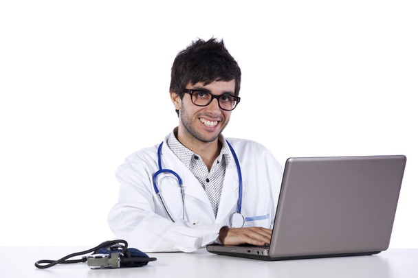 Frendly young doctor working with his laptop - Foto, Imagem