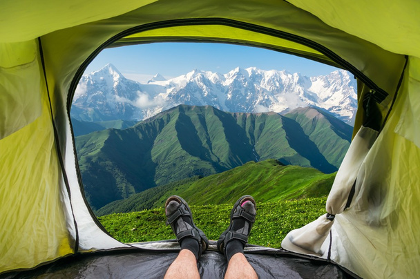 View from inside a tent on the snow-capped mountains in Georgia - Photo, Image