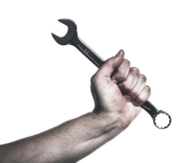 Mechanic hand hold spanner tool in hand - 写真・画像