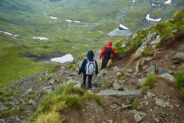 hikers descending on a mountai - Foto, Bild