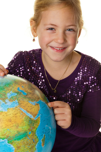 Child with a globe - Foto, afbeelding