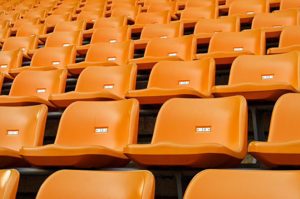 Orange Empty plastic seats at stadium - Photo, Image