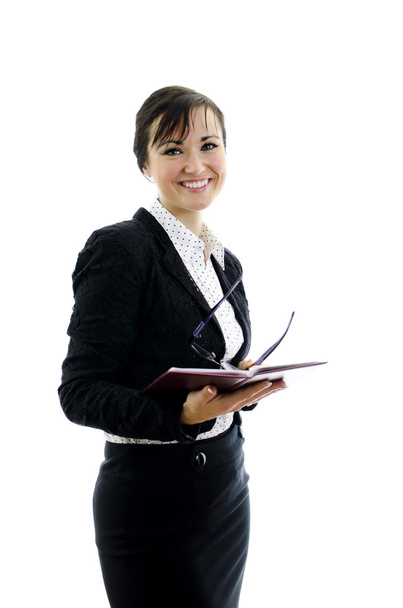 Mujer de negocios con gafas y bloc de notas aislados en blanco
 - Foto, imagen
