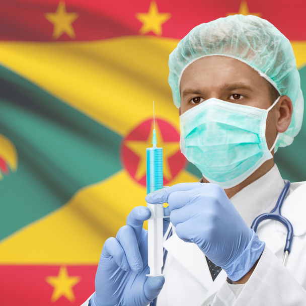 Γιατρός με σύριγγα στα χέρια και σημαία σειρά - Γρενάδα - Φωτογραφία, εικόνα
