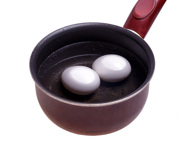 Chicken eggs are in metal pot - Photo, Image