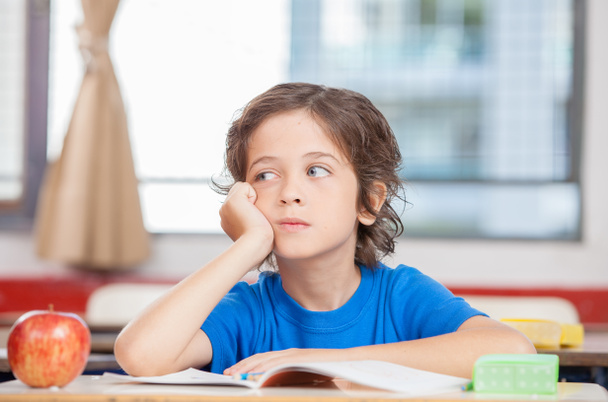 Thinking kid in school classroom - Photo, Image